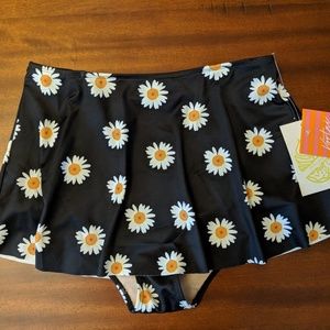 Kortni Jeane who wears short skirts swim bottoms